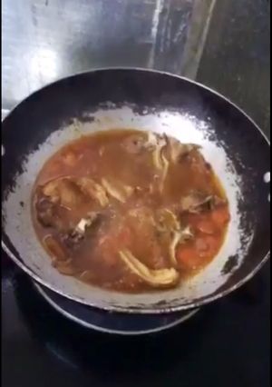 A picture of Pork on Tomato sauté with Fish sauce (kinamatisan pork-chop).