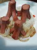 Pulpitos con cebolla dorada y acompañamiento (arroz)