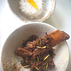 A picture of Rendang Western-style – Beef ribs in a spicy coconut sauce.