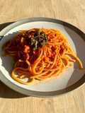 Bucatini with tuna, tomatoes and anchovies sambal topping