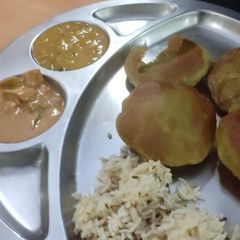 A picture of Palak peas puri, chana dal,panner.