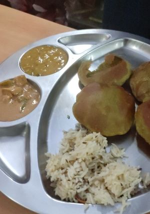 A picture of Palak peas puri, chana dal,panner.