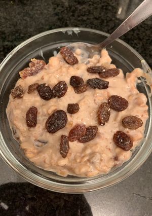 A picture of Raisin Oats With coco powder and Honey.