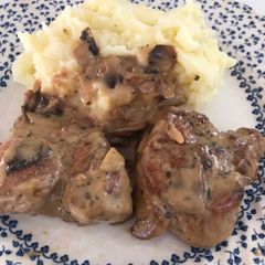 A picture of Pork medallions in mushroom Marsala sauce.
