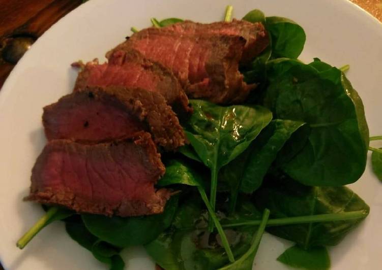 London broil over spinach salad