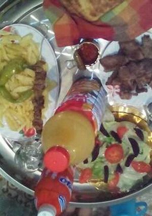 صورة لوصفة لحم مشوي فوق الطاوة
