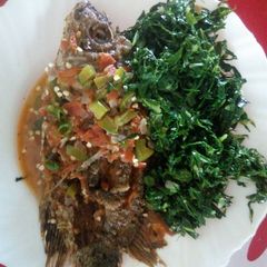 A picture of Fish stew and greens.