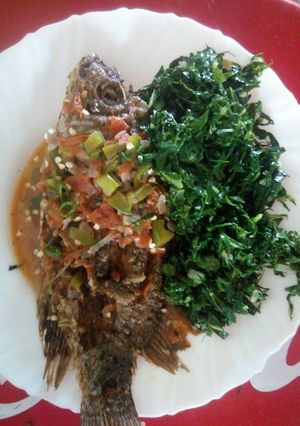 A picture of Fish stew and greens.