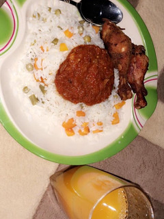 A picture of White fried rice wit mango juice.