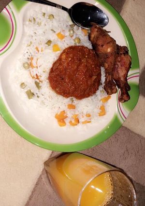 A picture of White fried rice wit mango juice.