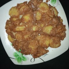 A picture of Fried potato in egg.
