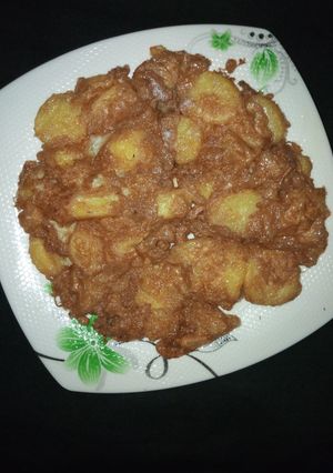 A picture of Fried potato in egg.