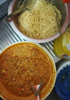 A picture of Spaghetti and egg tomato curry.