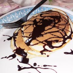 A picture of Pancake with chocolate topping.