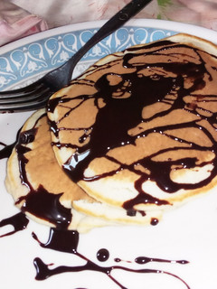 A picture of Pancake with chocolate topping.