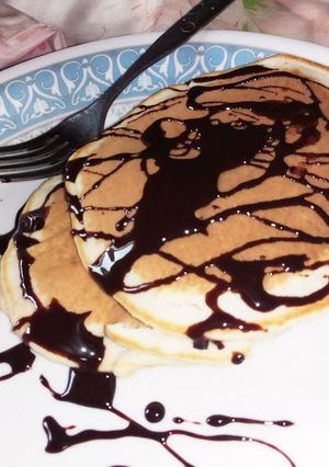 A picture of Pancake with chocolate topping.