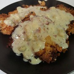 A picture of Salmon Patties with Dill Sauce .