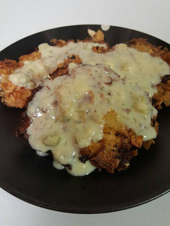 A picture of Salmon Patties with Dill Sauce .