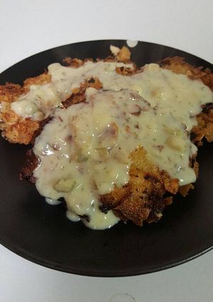 A picture of Salmon Patties with Dill Sauce .
