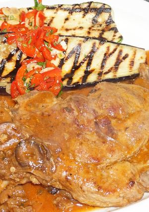 A picture of Marbled Pork Chops Braised in Merlot Wine Sauce.