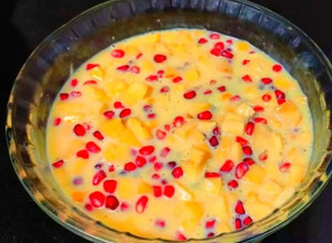 A picture of Mango, pomegranate custard.