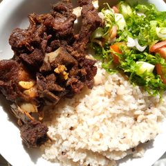 A picture of Rice and beans with fried beef.