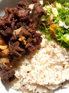 A picture of Rice and beans with fried beef.