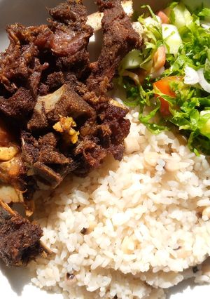 A picture of Rice and beans with fried beef.