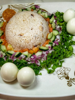 A picture of Rice and beans with salad.