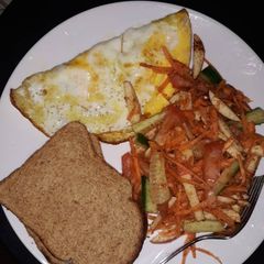 A picture of Brown bread/Omelet & mixed veggies.