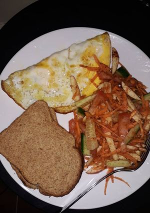A picture of Brown bread/Omelet & mixed veggies.