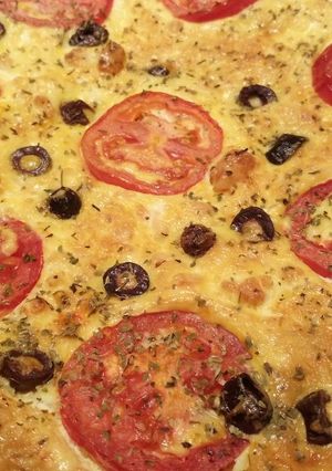 A picture of Tomato, olive and feta quiche.