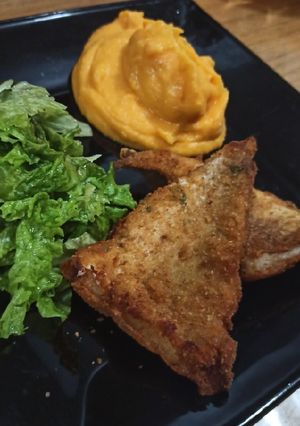 Una foto de Milanesa de merluza