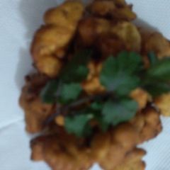 A picture of Onions And potatoes ka mix pakora.