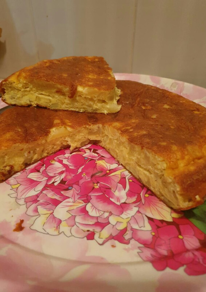 Una foto de Tortilla de patatas con queso añejo semigraso en polvo