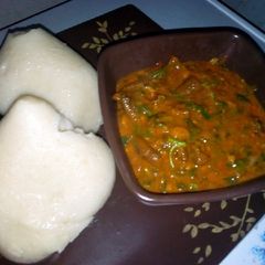 A picture of Tuwan semo with ogbono soup.