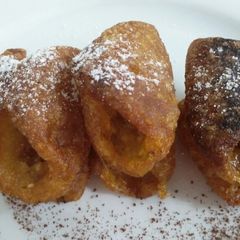 A picture of Sesame jaggery cannoli.