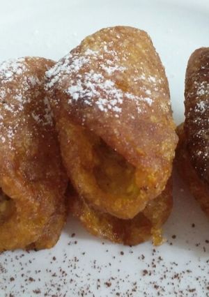 A picture of Sesame jaggery cannoli.