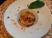 Una foto di spaghetti bottarga