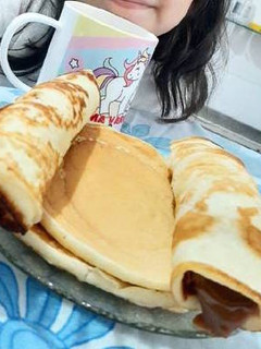 Una foto de Panqueques con dulce de leche