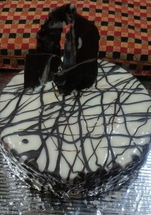 A picture of Eggless Whole wheat Vanilla cake with white chocolate ganache.
