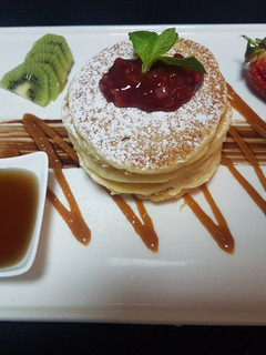 A picture of Pancake stack with maple syrup.