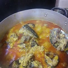 A picture of Egusi soup with oziza leaf.