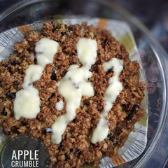 A picture of Apple crumble with custard.