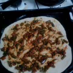 A picture of Pizza base sauce.
