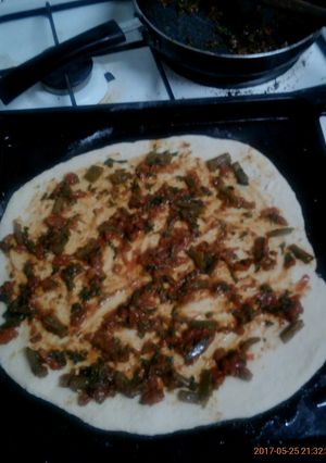 A picture of Pizza base sauce.