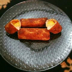 Bread toast roll ups with mango stuffing A picture of Bread toast roll ups with mango stuffing.