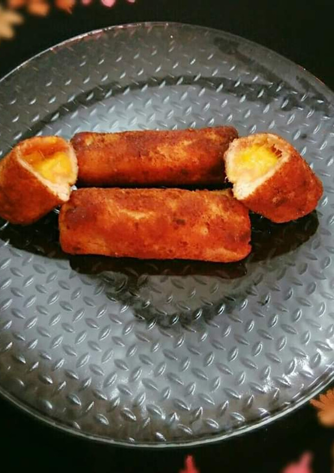 A picture of Bread toast roll ups with mango stuffing.