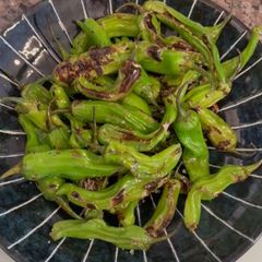 A picture of Charred Shishito Peppers.
