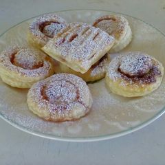 A picture of Strawberry jam and chocolate pastry parcels.